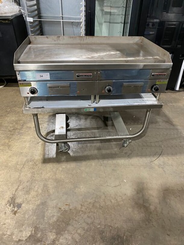 WOW! NEW! NEVER USED! Garland Commercial Countertop Electric Powered Flat Top Griddle! With Back And Side Splashes! On Legs! On Equipment Stand! All Stainless Steel! On Casters! Model: E2448G SN: 0404ME0033 208V 60HZ 3 Phase