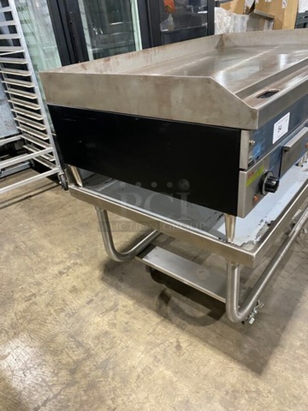 WOW! NEW! NEVER USED! Garland Commercial Countertop Electric Powered Flat Top Griddle! With Back And Side Splashes! On Legs! On Equipment Stand! All Stainless Steel! On Casters! Model: E2448G SN: 0404ME0033 208V 60HZ 3 Phase - Image 2 of 10