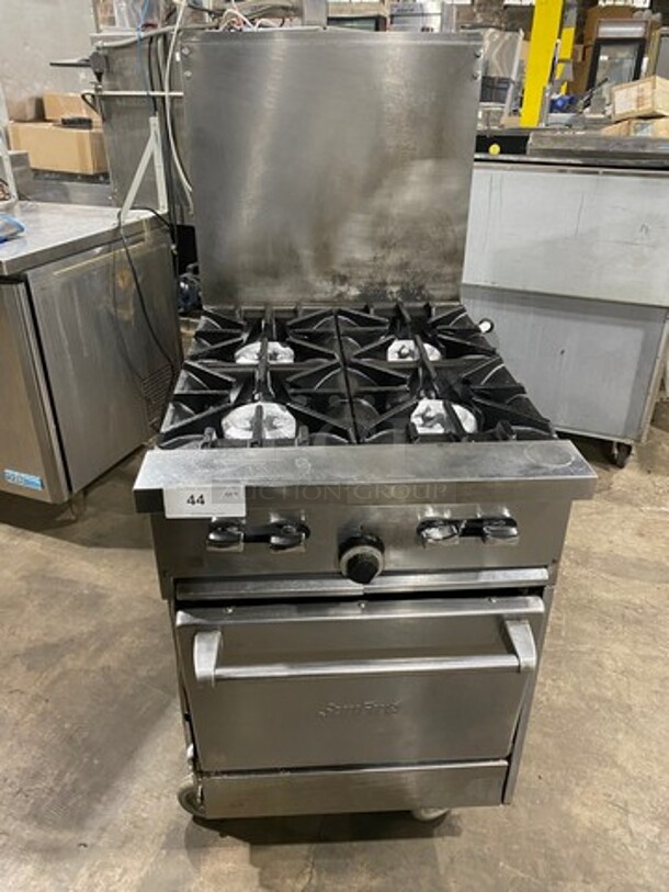 Sunfire Commercial Natural Gas Powered 4 Burner Stove! With Raised Back Splash! With Oven Underneath! All Stainless Steel! On Casters! - Image 1 of 11