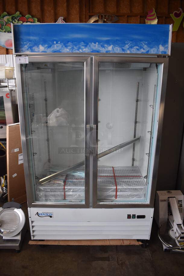 BRAND NEW SCRATCH AND DENT! Avantco 178GCD40HCW Metal Commercial 2 Door Reach In Cooler Merchandiser w/ Poly Coated Racks and LED Lighting on Commercial Casters. Right Door Is Missing 1 Pane of Glass. 115 Volts, 1 Phase. 48x27x85. Tested and Working! - Image 1 of 9