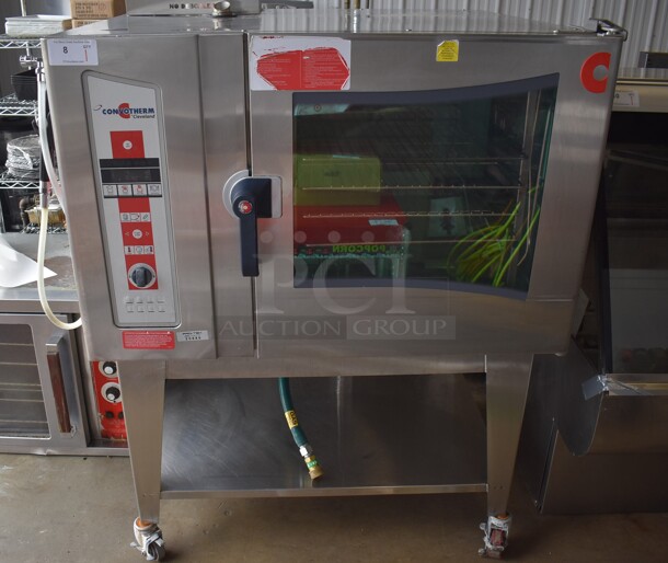 2010 Cleveland OGS-6.20 Stainless Steel Commercial Natural Gas Powered Combi Convection Oven w/ View Through Door, Metal Oven Racks and Under Shelf on Commercial Casters. 75,700 BTU. 51x44x61
