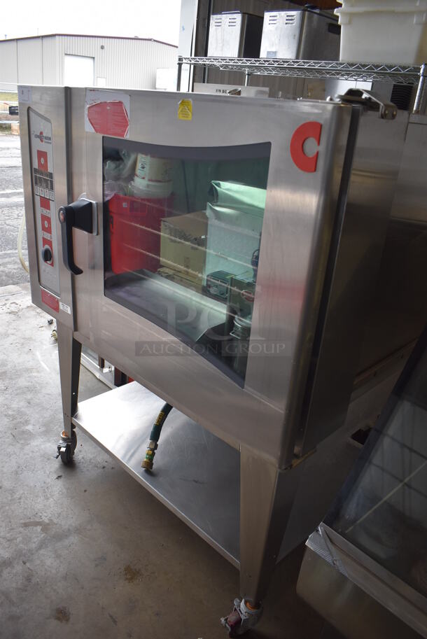 2010 Cleveland OGS-6.20 Stainless Steel Commercial Natural Gas Powered Combi Convection Oven w/ View Through Door, Metal Oven Racks and Under Shelf on Commercial Casters. 75,700 BTU. 51x44x61 - Image 5 of 9