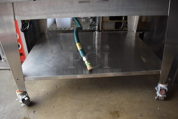 2010 Cleveland OGS-6.20 Stainless Steel Commercial Natural Gas Powered Combi Convection Oven w/ View Through Door, Metal Oven Racks and Under Shelf on Commercial Casters. 75,700 BTU. 51x44x61 - Image 6 of 9