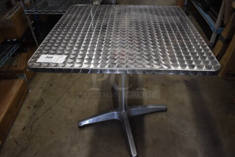 Chrome Finish Table on Metal Legs. 27.5x27.5x27.5