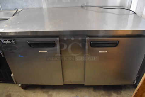 2017 Leader ESLB60 S/C Stainless Steel Commercial 2 Door Undercounter Cooler on Commercial Casters. 115 Volts, 1 Phase. 60x32x36. Tested and Powers On But Does Not Get Cold