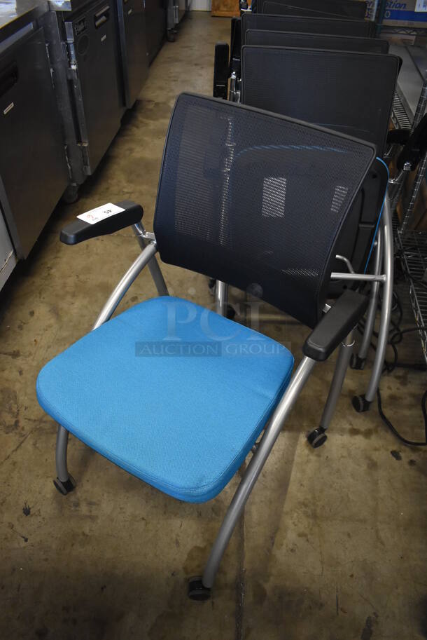 6 Black and Blue Foldable Chairs w/ Arm Rests on Casters. Stock Picture - Cosmetic Condition May Vary. 24x23x36. 6 Times Your Bid! - Image 3 of 6