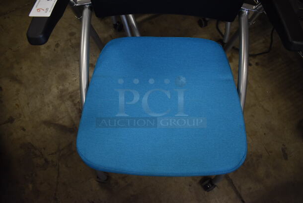 6 Black and Blue Foldable Chairs w/ Arm Rests on Casters. Stock Picture - Cosmetic Condition May Vary. 24x23x36. 6 Times Your Bid! - Image 4 of 6