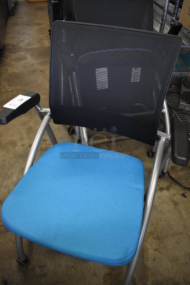 6 Black and Blue Foldable Chairs w/ Arm Rests on Casters. Stock Picture - Cosmetic Condition May Vary. 24x23x36. 6 Times Your Bid! - Image 5 of 6