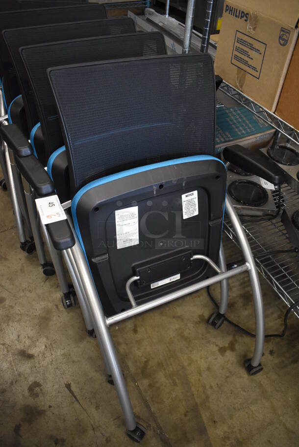 6 Black and Blue Foldable Chairs w/ Arm Rests on Casters. Stock Picture - Cosmetic Condition May Vary. 24x23x36. 6 Times Your Bid! - Image 6 of 6