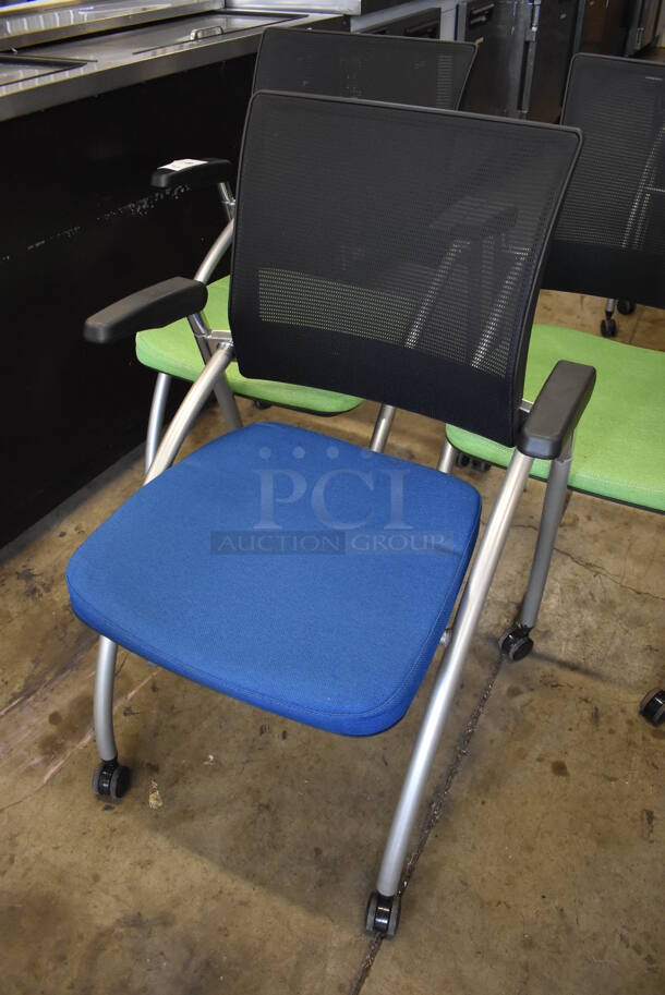 3 Foldable Chairs w/ Arm Rests on Casters. 2 Green and 1 Blue. Stock Picture - Cosmetic Condition May Vary. 24x23x36. 3 Times Your Bid! - Image 3 of 6