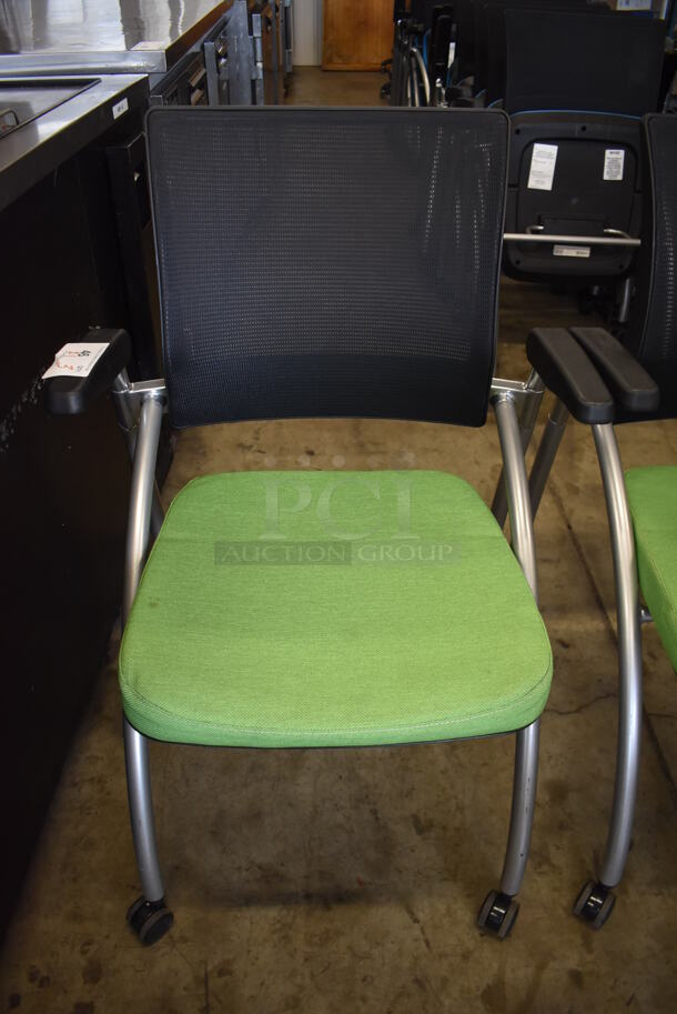 3 Foldable Chairs w/ Arm Rests on Casters. 2 Green and 1 Blue. Stock Picture - Cosmetic Condition May Vary. 24x23x36. 3 Times Your Bid! - Image 5 of 6