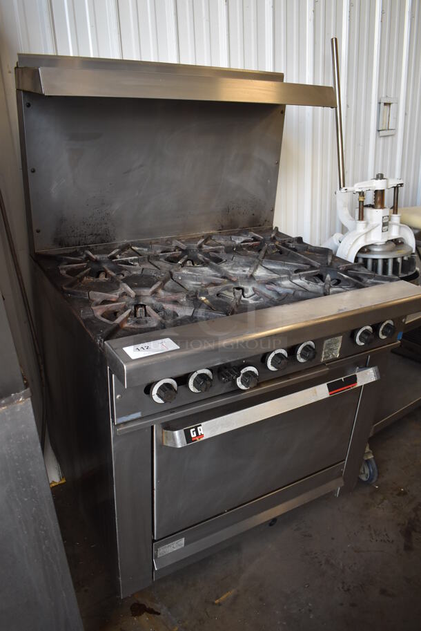 Garland Stainless Steel Commercial Natural Gas Powered 6 Burner Range w/ Oven, Over Shelf and Back Splash. 36x33x61.5