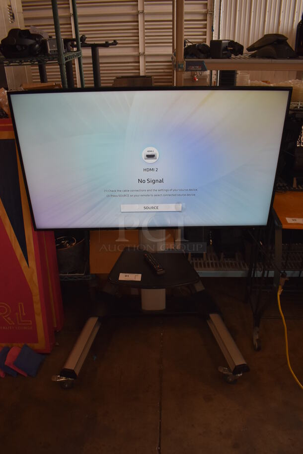 Samsung 50" 4K Smart LED Television on Cart. 120 Volts, 1 Phase. 44x32x55. Buyer Must Pick Up - We Will Not Ship This Item. Tested and Working! - Image 1 of 9