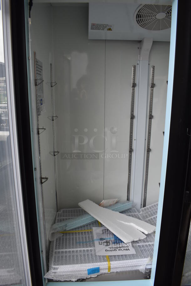 BRAND NEW SCRATCH AND DENT! Avantco 178GDC49FHCB Metal Commercial 2 Door Reach Freezer Merchandiser w/ LED Lighting and Poly Coated Racks on Commercial Casters. 115 Volts, 1 Phase. 53x32x84. Tested and Working! - Image 3 of 8