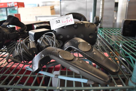 HTC VR Headset w/ 2 HTC Controllers,  2 HTC 2PR8100 Vive Base Stations and 2 Base Station Chargers. 9x12x6, 4.5x5x9, 3.5x2.5x3.5