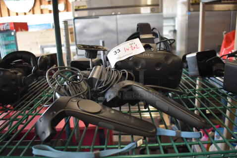 HTC VR Headset w/ 2 HTC Controllers,  2 HTC 2PR8100 Vive Base Stations and 2 Base Station Chargers. 9x12x6, 4.5x5x9, 3.5x2.5x3.5