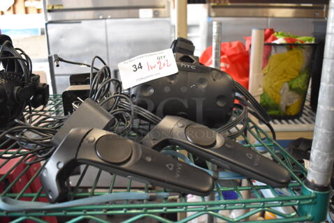 HTC VR Headset w/ 2 HTC Controllers,  2 HTC 2PR8100 Vive Base Stations and 2 Base Station Chargers. 9x12x6, 4.5x5x9, 3.5x2.5x3.5