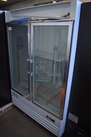 BRAND NEW SCRATCH AND DENT! Avantco 178GDC49FHCW Metal Commercial 2 Door Reach In Freezer Merchandiser w/ LED Lighting and Poly Coated Racks on Commercial Casters. 115 Volts, 1 Phase. 53x32x84. Tested and Working!
