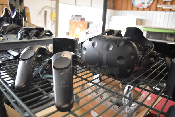 HTC VR Headset w/ 2 HTC Controllers,  2 HTC 2PR8100 Vive Base Stations and 2 Base Station Chargers. 9x12x6, 4.5x5x9, 3.5x2.5x3.5 - Image 2 of 8
