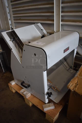 BRAND NEW! Estella Metal Commercial Countertop Bread Loaf Slicer. 5/8" Slice Thickness. 110 Volts, 1 Phase. 24x28x28. Tested and Working!