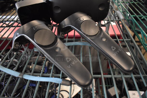 HTC VR Headset w/ 2 HTC Controllers,  2 HTC 2PR8100 Vive Base Stations and 2 Base Station Chargers. 9x12x6, 4.5x5x9, 3.5x2.5x3.5 - Image 2 of 7