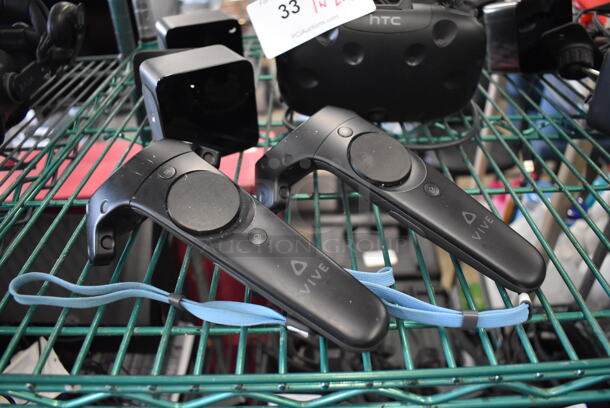 HTC VR Headset w/ 2 HTC Controllers,  2 HTC 2PR8100 Vive Base Stations and 2 Base Station Chargers. 9x12x6, 4.5x5x9, 3.5x2.5x3.5 - Image 2 of 7