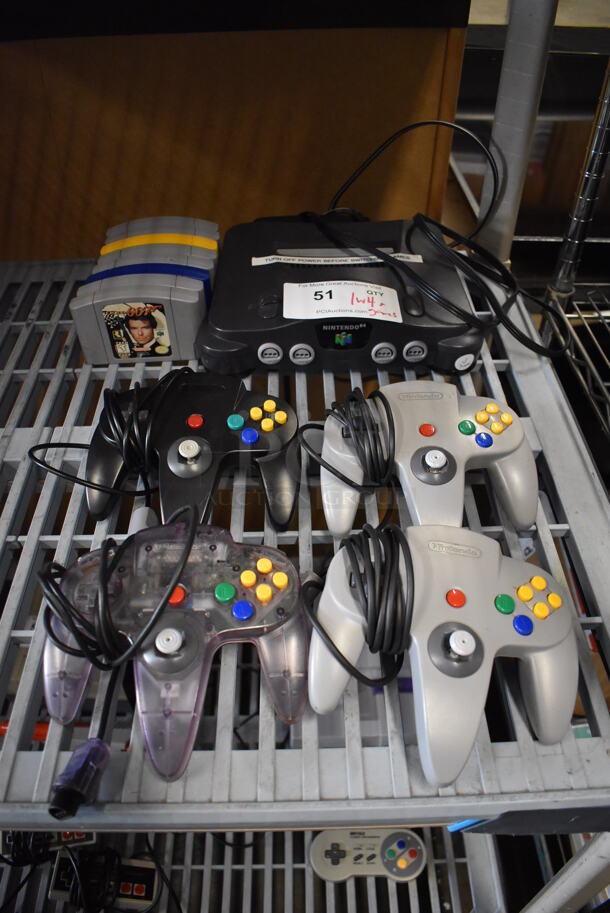 Nintendo 64 NUS-001 Countertop Video Game Console w/ 4 Controllers and 8 Various Games. 10.5x9x3