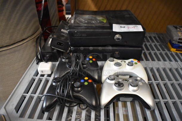 2 Xbox 360 Game Consoles w/ 4 Controllers, NHL 08 Ice Hockey Game and Halo Game. 10.5x10.5x2.5. 2 Times Your Bid!