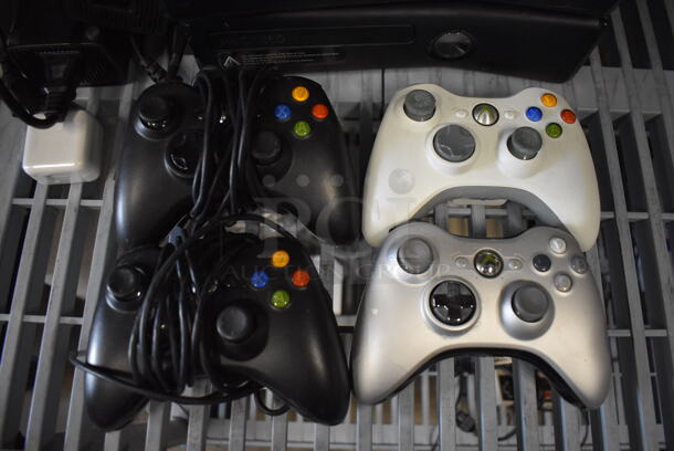 2 Xbox 360 Game Consoles w/ 4 Controllers, NHL 08 Ice Hockey Game and Halo Game. 10.5x10.5x2.5. 2 Times Your Bid! - Image 3 of 6
