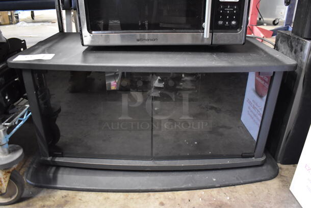 Black TV Stand w/ 2 Glass Doors. 32x20x15 - Image 1 of 4