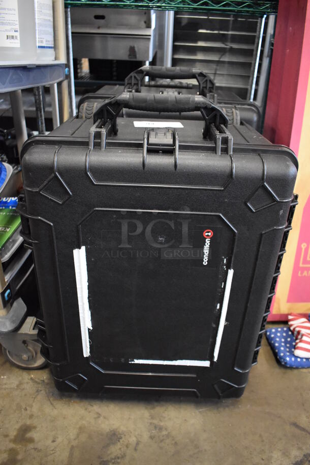 2 Condition 1 Black Hard Cases w/ Handle and 2 Wheels. 18x25x15. 2 Times Your Bid!