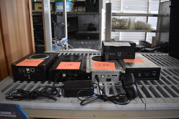 5 Various Electronic Units IncludingI Dsonix iDD-U3102 Super Speed USB, 300 GB Enclosed Hard Drive, 1 TB Enclosed Hard Drive, 1 TB Enclosed Hard Drive and 750 GB Enclosed Hard Drive. 5 Times Your Bid! - Image 1 of 11