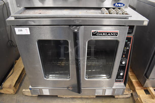 Garland Master 200 Stainless Steel Commercial Electric Powered Full Size Convection Oven w/ View Through Doors and Thermostatic Controls. 208-208 Volts, 1/3 Phase. 38x38x33