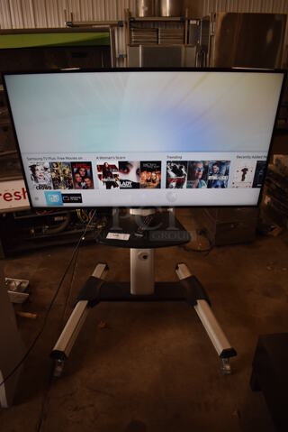 Samsung 50" 4K Smart LED Television on Cart. 120 Volts, 1 Phase. 44x32x55. Buyer Must Pick Up - We Will Not Ship This Item. Tested and Working!