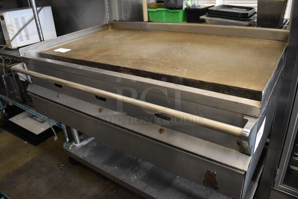 Wolf Stainless Steel Commercial Natural Gas Powered Flat Top Griddle w/ Under Shelf on Commercial Casters. 48x34x38