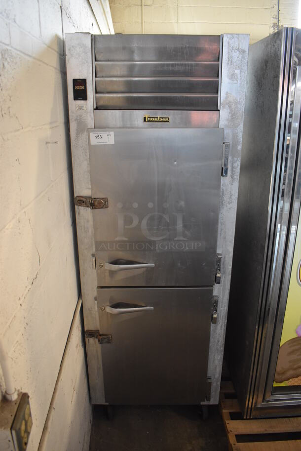 Traulsen G12000 Stainless Steel Commercial 2 Half Size Door Reach In Freezer w/ Poly Coated Racks on Commercial Casters. 115 Volts, 1 Phase. 30x34x83. Tested and Working!