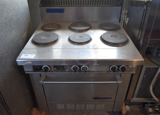 Garland Stainless Steel Commercial Electric Powered 6 Burner Hot Plate Range w/ Oven and Back Splash. 208-250 Volts, 1 or 3 Phase. 36x36x48