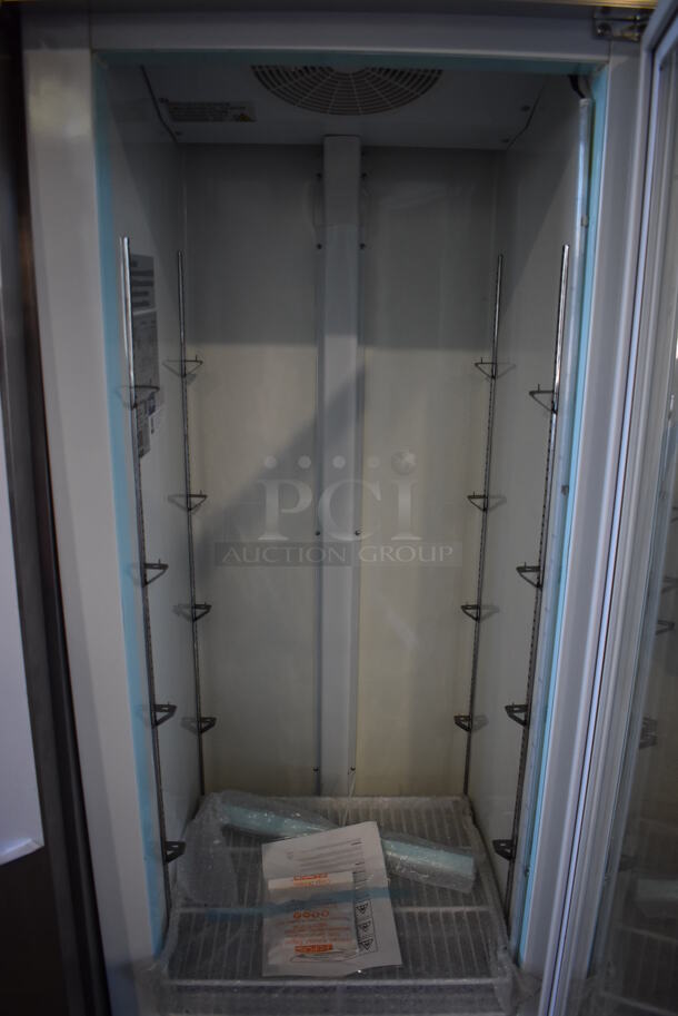 BRAND NEW SCRATCH AND DENT! Avantco 178GCD12FHCW Metal Commercial Single Door Reach In Freezer Merchandiser w/ Poly Coated Racks and LED Lighting on Commercial Casters. 115 Volts, 1 Phase. 27x26x83. Tested and Working! - Image 3 of 6