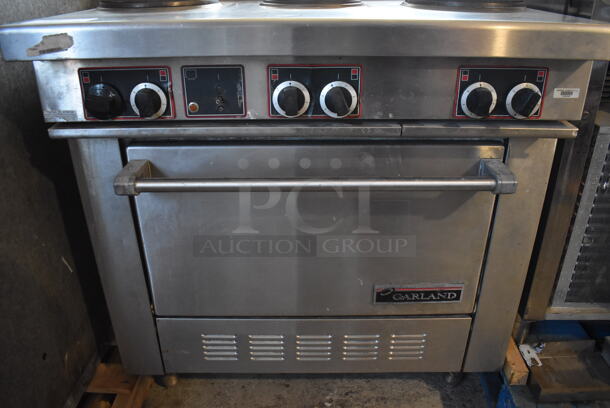 Garland Stainless Steel Commercial Electric Powered 6 Burner Hot Plate Range w/ Oven and Back Splash. 208-250 Volts, 1 or 3 Phase. 36x36x48 - Image 6 of 7