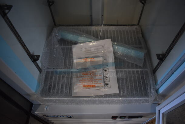 BRAND NEW SCRATCH AND DENT! Avantco 178GCD12FHCW Metal Commercial Single Door Reach In Freezer Merchandiser w/ Poly Coated Racks and LED Lighting on Commercial Casters. 115 Volts, 1 Phase. 27x26x83. Tested and Working! - Image 5 of 6