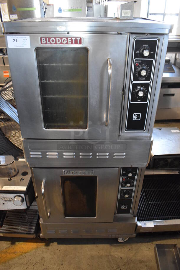 2 Blodgett Stainless Steel Commercial Natural Gas Powered Half Size Convection Oven w/ View Through Doors, Metal Oven Racks and Thermostatic Controls on Commercial Casters. 30x25x67. 2 Times Your Bid!