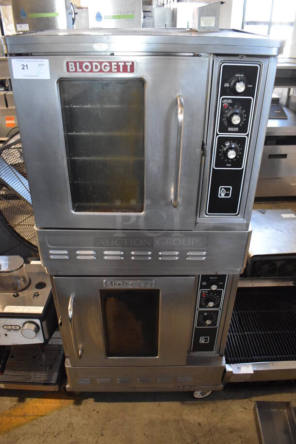 2 Blodgett Stainless Steel Commercial Natural Gas Powered Half Size Convection Oven w/ View Through Doors, Metal Oven Racks and Thermostatic Controls on Commercial Casters. 30x25x67. 2 Times Your Bid! - Image 1 of 8