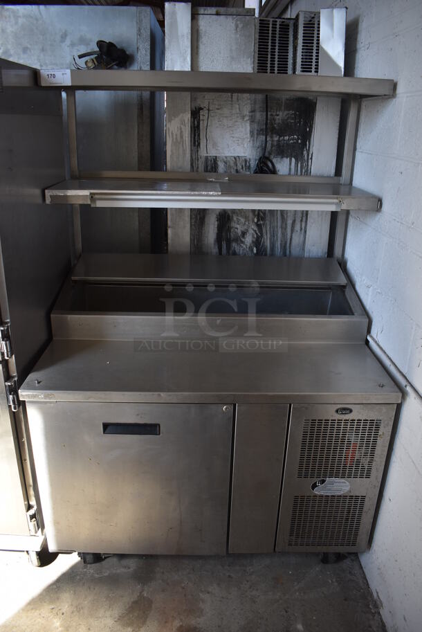 Randell 8148NM Stainless Steel Commercial Pizza Prep Table w/ 2 Over Shelves on Commercial Casters. 115 Volts, 1 Phase. 48x34x72. Tested and Powers On But Does Not Get Cold