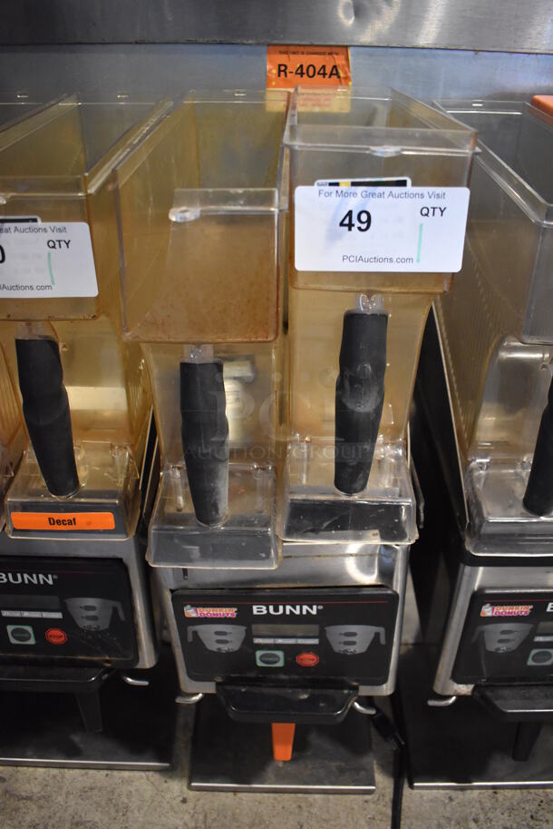 2010 Bunn MHG Stainless Steel Commercial Countertop 2 Hopper Coffee Bean Grinder w/ Metal Brew Basket. Missing Lids. See Pictures For Damage. 120 Volts, 1 Phase. 9x17x29. Tested and Powers On But Parts Do Not Move - Image 1 of 11