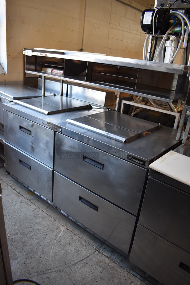 ALL ONE MONEY! Lot of 2 Delfield Stainless Steel Commercial Prep Table w/ 2 Drawers Connected w/ an Over Shelf. 115 Volts, 1 Phase. 64.5x34x55. Tested and Powers On But Does Not Get Cold