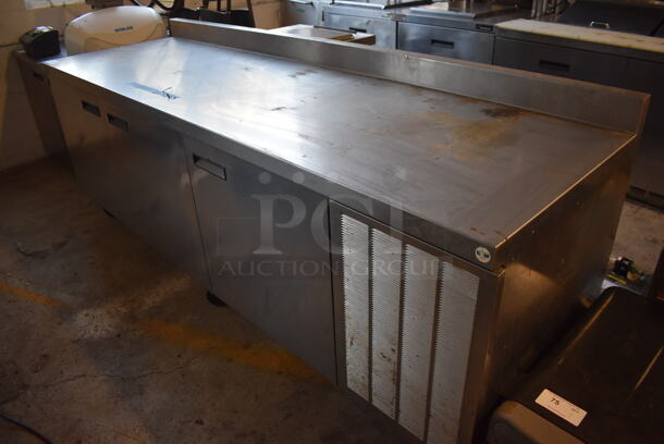 Delfield Stainless Steel Commercial 3 Door Work Top Cooler w/ Back Splash on Commercial Casters. 115 Volts, 1 Phase. 99x32x39. Tested and Powers On But Does Not Get Cold