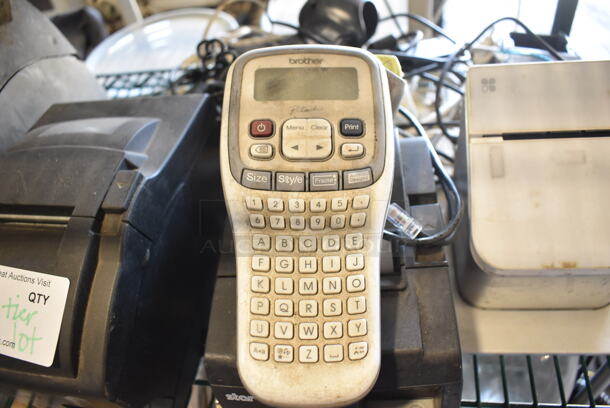 ALL ONE MONEY! Tier Lot of Various Items Including Poly Paper Towel Dispenser, Star Micronics SP700 Receipt Printer, Star Micronics TSP100 Receipt Printer, Brother Label Maker and Clover P100 Receipt Printer - Image 6 of 7