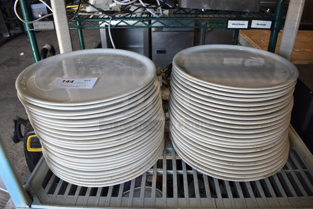 ALL ONE MONEY! Tier Lot of Approximately 47 White Ceramic Plates. 13x13x1
