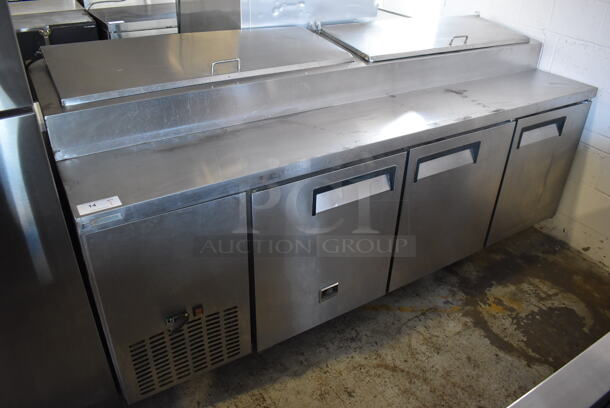 Kelvinator KCPT92.12 Stainless Steel Commercial Pizza Prep Table on Commercial Casters. 115 Volts, 1 Phase. 92x32x45. Tested and Powers On But Does Not Get Cold