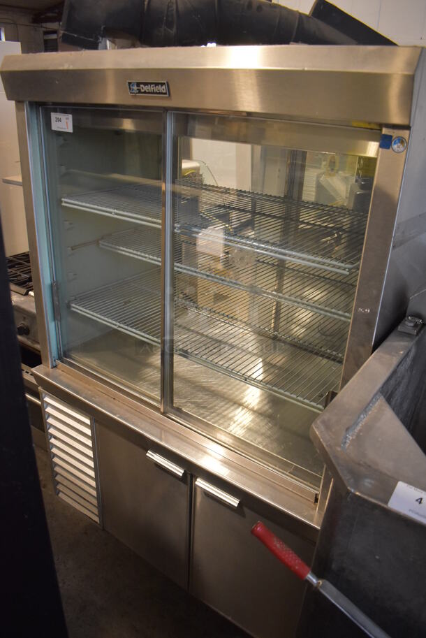 Delfield Stainless Steel Commercial Refrigerated Display Case Merchandiser w/ 2 Door Lower Cooler. 48x35x78. Tested and Working!
